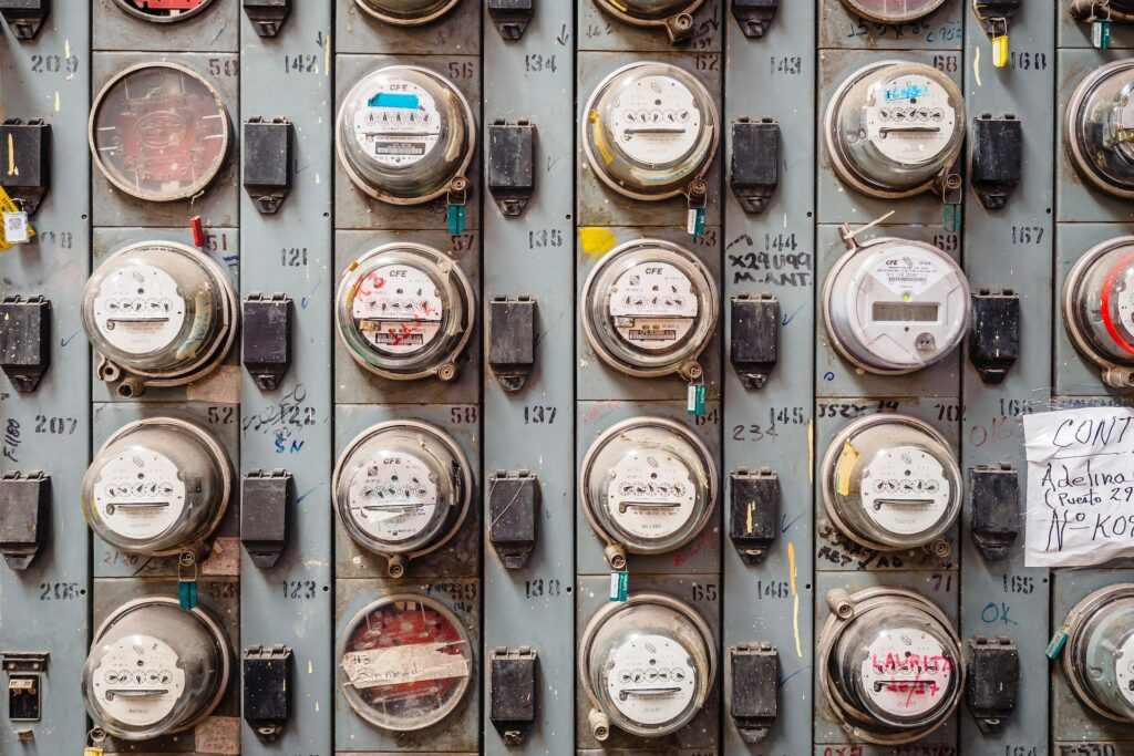 A wall of many electrical meters