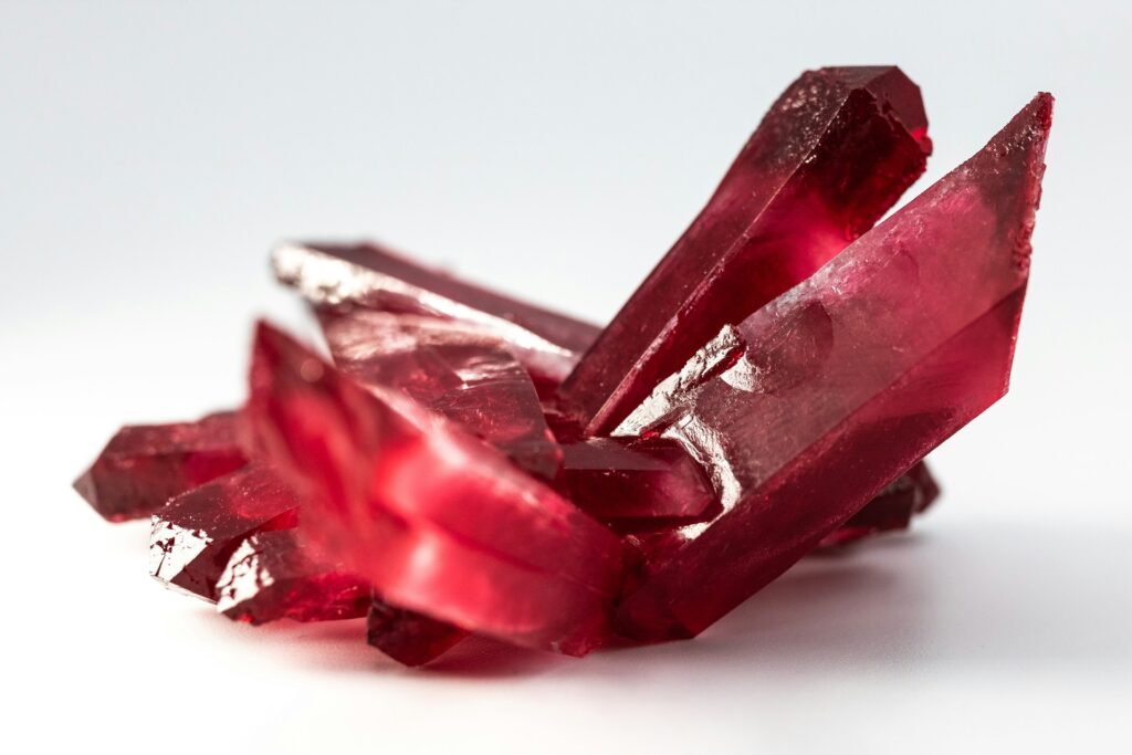 An uncut ruby on a white background